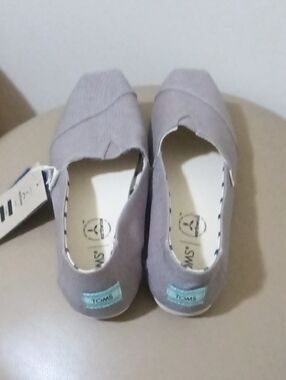 TOMS Kids Slip-On Moccasins in Light Gray with Blue Heel Tab